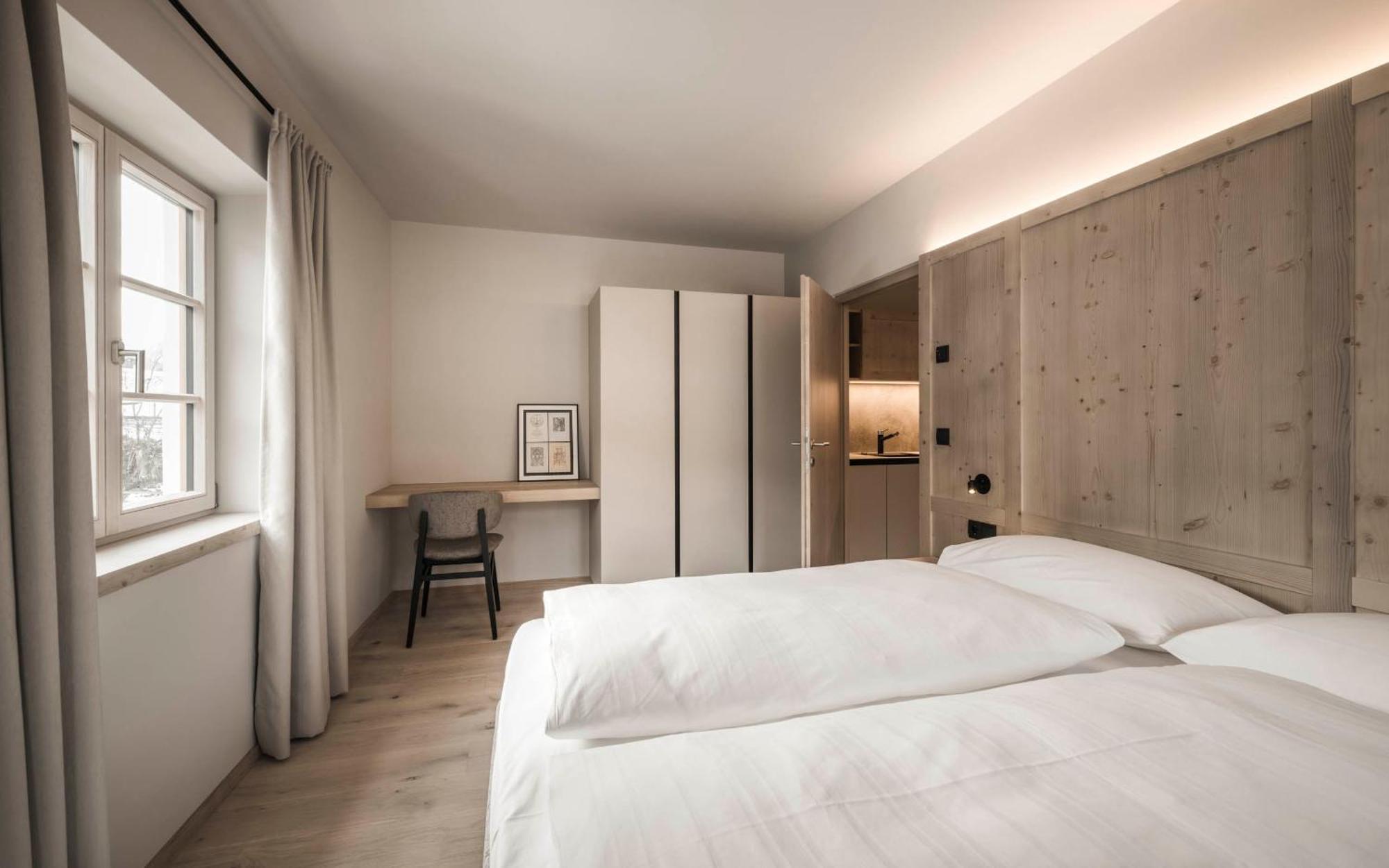 Hofergut Suites & Apartments Riscone Pokoj fotografie